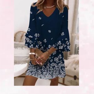 Nora Cora navy dress with white flowers. 3/4 sleeves.